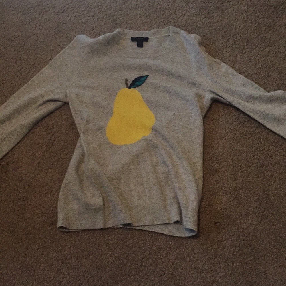 Light grey sweater with a yellow pear design.